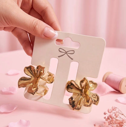 Pinzas minis de flor doradas